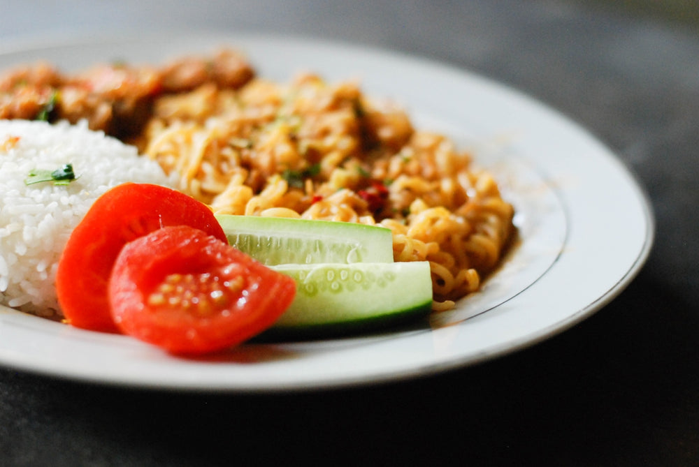 pasta with tomato sauce on white ceramic plate
