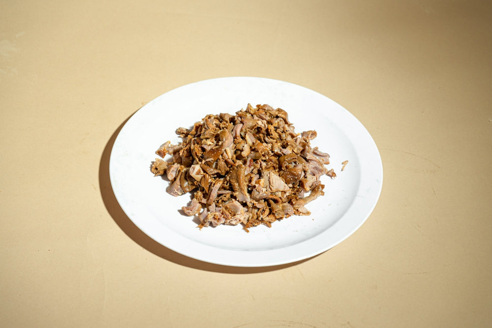 A white plate topped with food on top of a table