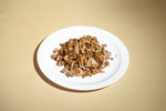 A white plate topped with food on top of a table